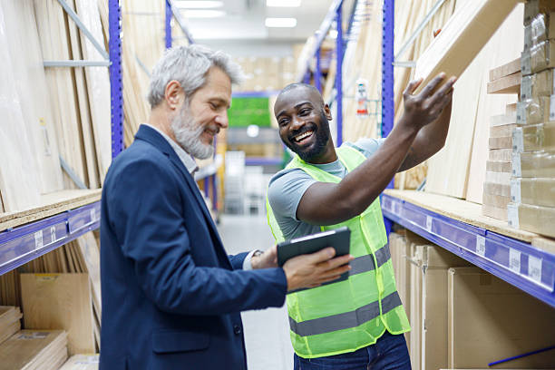 istock Two men, a manager and a worker, collaborating in a warehouse, inspecting stock and managing inventory with a digital tablet 2249313839