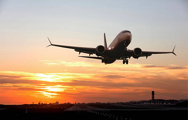istock Passenger airplane is taking off at sunset 2249314552