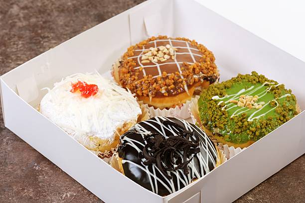Assorted Donuts with Colorful Toppings in Box