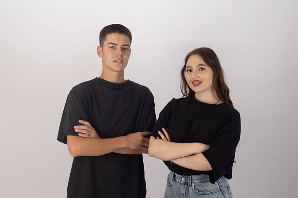 istock Young man and woman standing side by side with relaxed, 2249315864