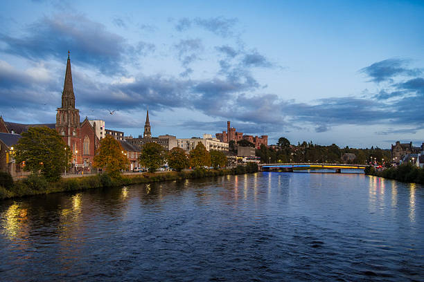 istock Inverness skyline reflecting in river ness at dusk 2249316555