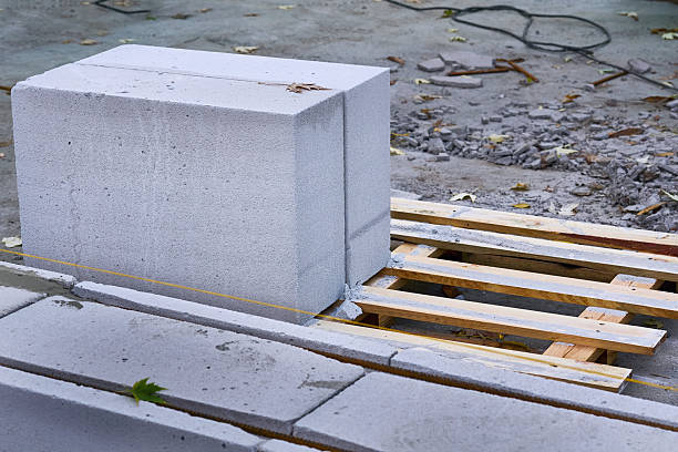 istock Wooden pallet with cellular aerated concrete blocks,ready to lay bricks 2249317348