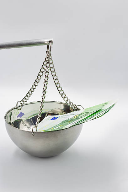 istock 100 Euro banknotes on balance scale symbolizing financial justice concept. 2249318095