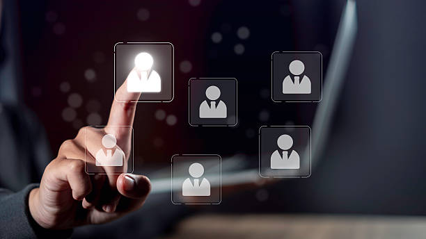 istock Human manager selection concept with hand pointing at virtual profile icon on screen. Represents HR management, digital recruitment, employee choice, and business workforce planning system. 2249319678