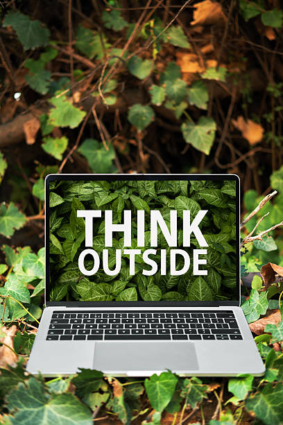 istock Laptop screen displaying think outside text outdoors 2249320664