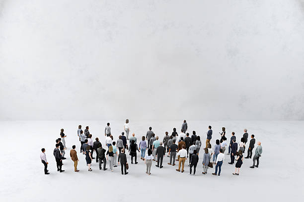 istock Group of people gathered in front of white wall background 2249321161