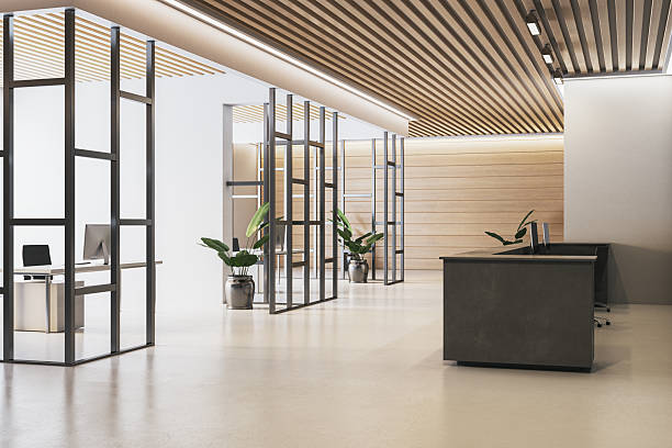 istock Modern corporate reception area with sleek desk, open office layout, wooden ceiling panels, and minimalistic design elements in neutral tones. 3D Rendering 2249322507