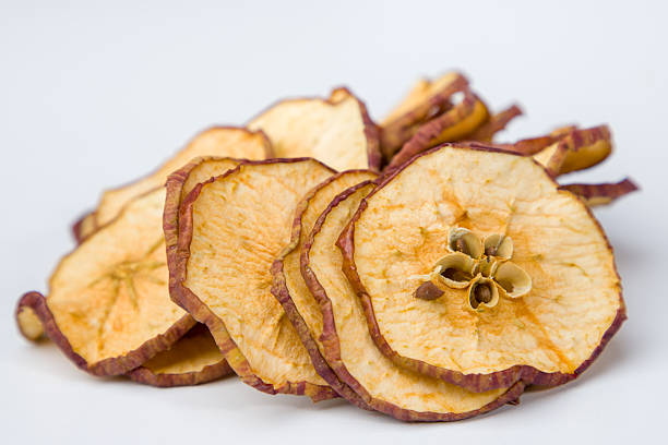 istock Dried apple slices on a white background. Healthy food concept. 2249322650