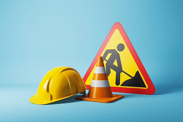 istock Construction safety equipment including helmet, cone, and warning sign on light blue gradient background. 3D Rendering concept of caution scene. 3D Rendering 2249323177