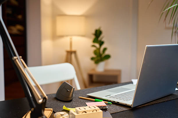 istock Home office workspace with laptop and vertical mouse on desk 2249327405