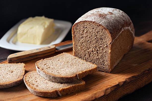 istock Rye bread loaf on wooden board 2249329510