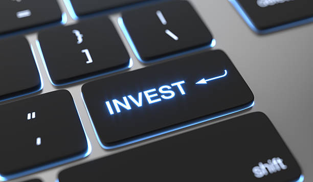 istock Glowing computer keyboard key labeled Invest symbolizing digital finance and growth 2249329595