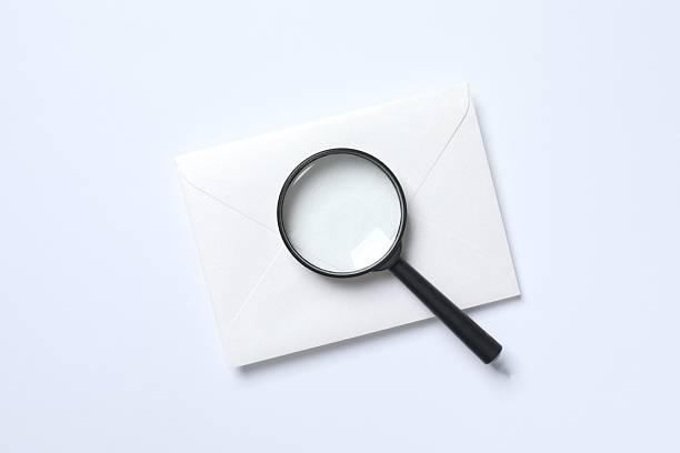 Magnifying glass with paper card on white background