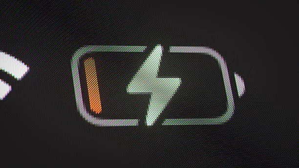 Macro shot of a smartphone or tablet screen showing a low battery charging icon with pixel texture visible. 3D render