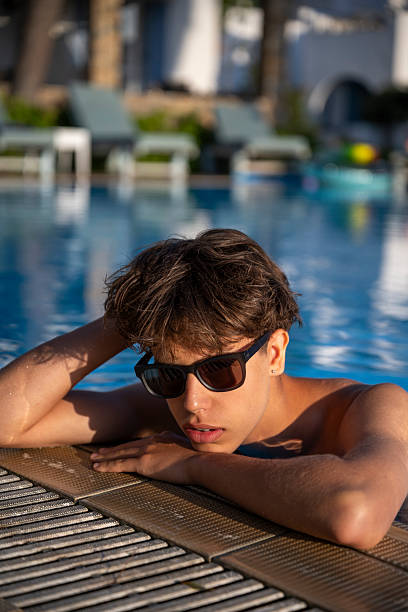 istock Teen Enjoying Quiet Poolside Sunset 2249335483