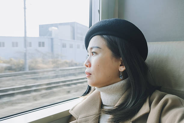 istock Passenger Looking Out Window During Train Ride. Stock Photo 2249336639