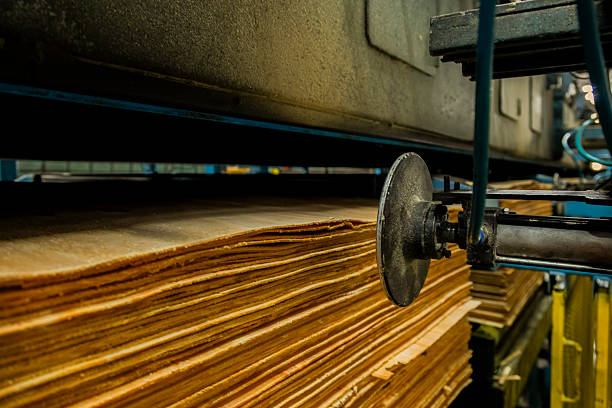 Close-up of stacked plywood layers showing industrial production and construction material texture.