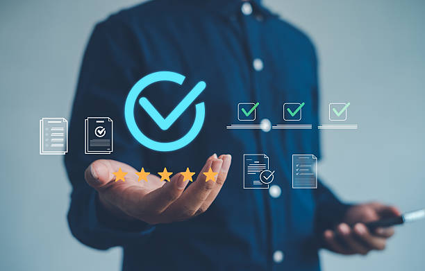 istock Business quality assurance concept with digital checkmark icon, 5-star rating, and document validation representing trust, compliance, and professional certification for corporate success. 2249338234