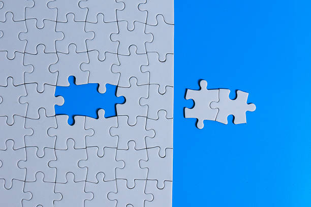 istock White puzzle with a missing piece showing a blue gap 2249338493