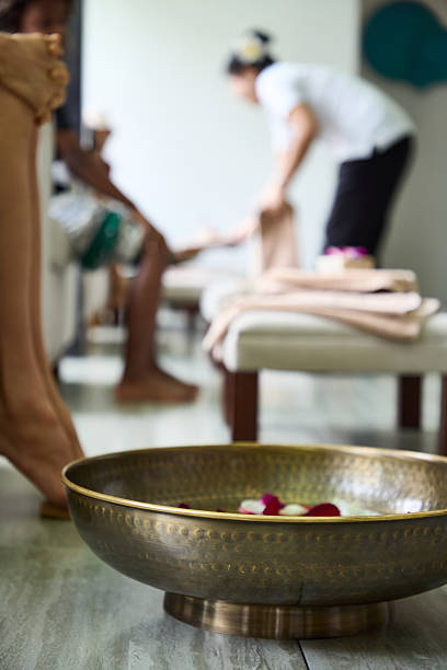 Elegant spa scene featuring a decorative brass bowl and relaxing atmosphere