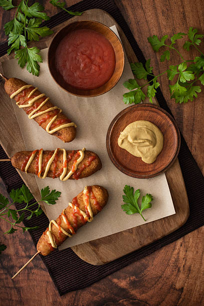 Homemade Corn dogs on a rustic background