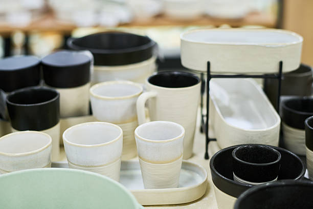 istock Ceramic Cups and Bowls Arranged on Table in Contemporary Pottery Display 2249341668