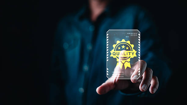 istock Businessman touching a virtual quality assurance badge on digital interface, symbolizing standard certification, high performance, and product guarantee in modern technology industry. 2249344056