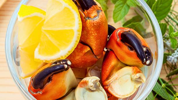 istock Freshly cooked stone crab claws with lemon slices 2249347548