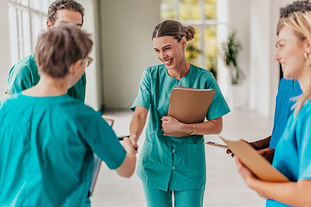 istock Healthcare workers collaborating and supporting each other in a hospital setting, showcasing teamwork and professionalism 2249349365
