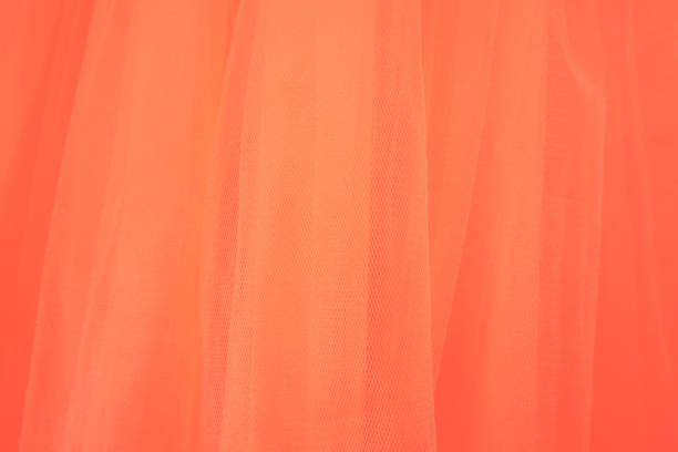 Yellow natural vibrant linen textile background. Top view. Flat lay, copy space. Abstract orange fabric cloth background