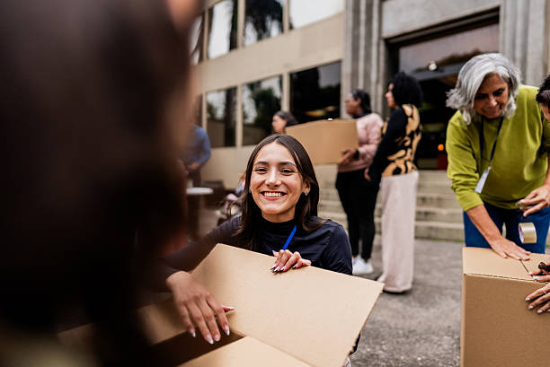 istock Young woman participating in community donation drive 2249355032