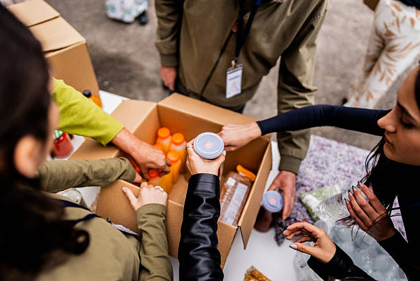 istock Volunteers sorting food donations for community support - Close-up 2249355102