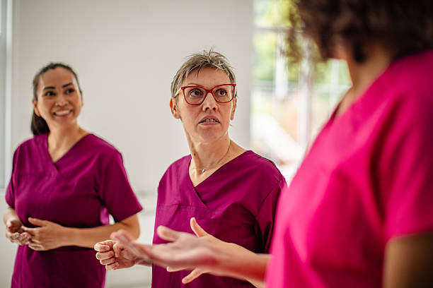 istock Healthcare workers engaging in a team discussion in a modern hospital setting 2249355534