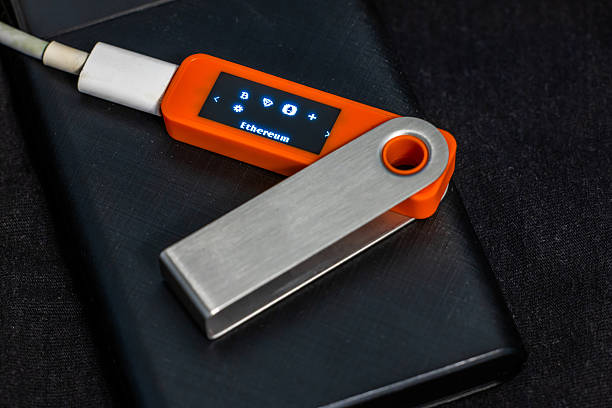 Close-up of cryptocurrency hardware wallet with Ethereum word on its screen