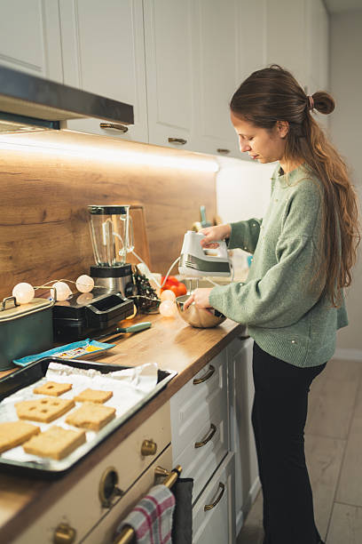 istock Holiday Baking – Whipping Cream Next to Gingerbread House Pieces 2249361223