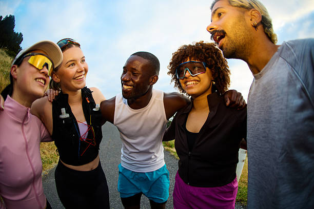 istock Diverse friends enjoying morning run, smiling together 2249362355