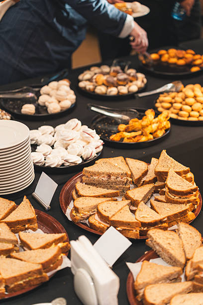 istock Business Professionals Enjoying Pastry Buffet at Lunch Break 2249362662