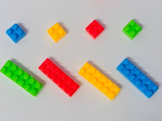 istock Colorful Building Blocks : Educational and Creative Toy Bricks for Kids and Montessori Learning. Plastic building blocks isolated on white background 2249362759
