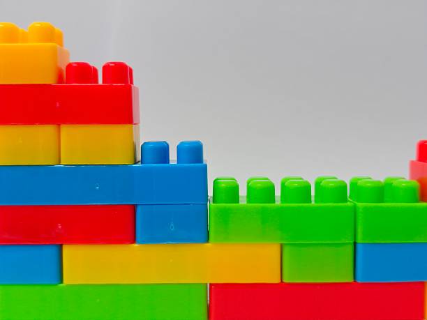 istock Colorful Building Blocks : Educational and Creative Toy Bricks for Kids and Montessori Learning. Plastic building blocks isolated on white background 2249362806