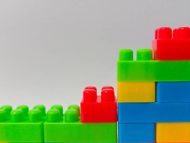 istock Colorful Building Blocks : Educational and Creative Toy Bricks for Kids and Montessori Learning. Plastic building blocks isolated on white background 2249362877
