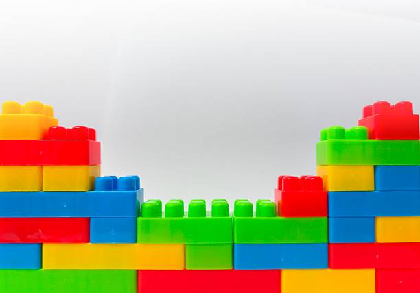 istock Colorful Building Blocks : Educational and Creative Toy Bricks for Kids and Montessori Learning. Plastic building blocks isolated on white background 2249362880