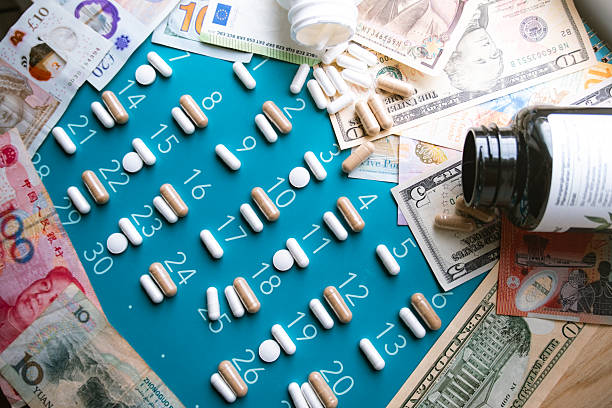Medicine pills placed in a calendar, and paper money