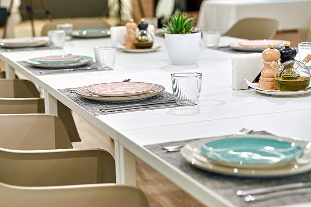 istock Elegant Dining Setup with Tastefully Arranged Plates, Glassware, and Centerpiece on a Sleek Table Ready for a Memorable Meal Experience 2249363060