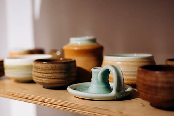istock Handmade candle holder and tableware on store shelf. 2249364170