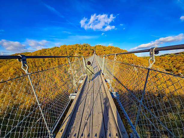 istock Autumn Sunset over the Suspension Bridge 2249364438