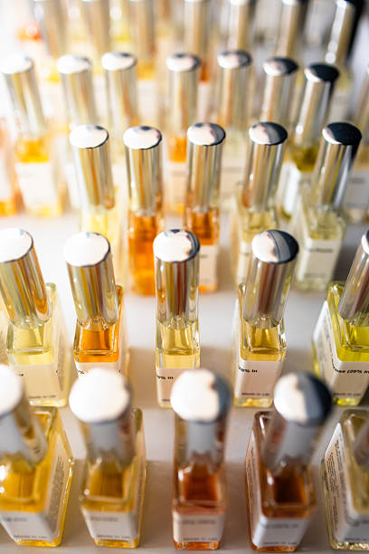 istock Bottles of perfume in a row 2249366488