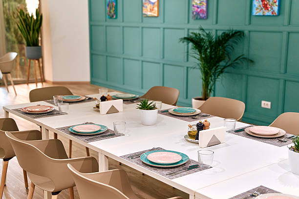 istock A Stylishly Set Dining Table with Elegant Dinnerware Surrounded by Modern Decor in a Bright and Inviting Space Perfect for Gatherings 2249368179
