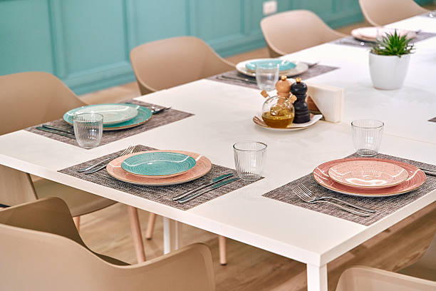 istock Elegant Dining Table Set with Pastel Plates and Minimalist Decor for a Stylish Meal Experience 2249368620