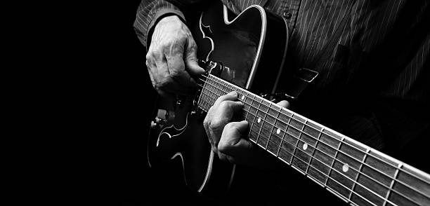 istock Playing an Acoustic Guitar. Black and white. Copy space 2249369444