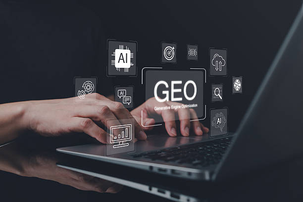 istock Close up of hands typing on laptop with floating GEO generative engine optimization graphics and AI technology icons, symbolizing digital strategy, innovation, and advanced data driven optimization. 2249370066